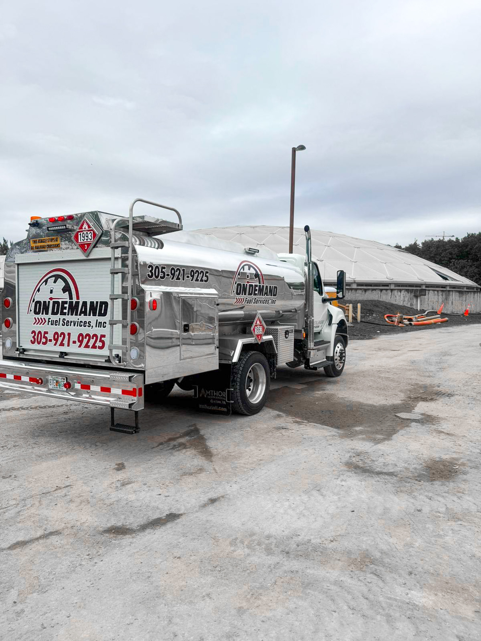 Professional fuel delivery truck providing diesel fuel services